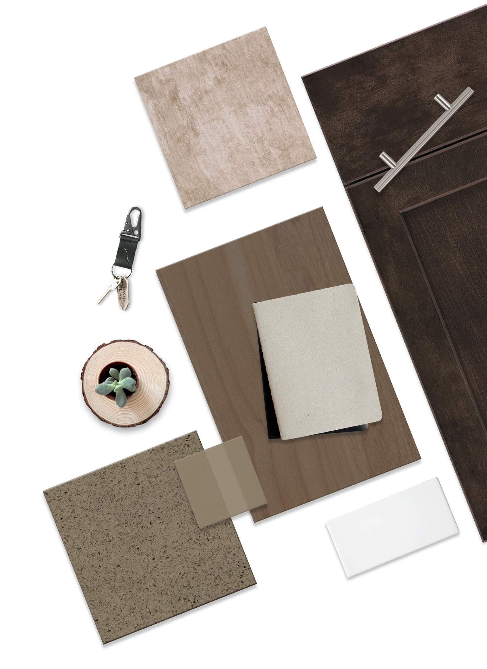 Material samples including tiles, wood plank, countertop square with a beige notebook, dark cabinet door and metal handle, succulent on a wood slice and key fob, arranged flat on white as a moodboard.