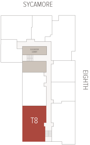 Red room labeled T8 occupies the southern end of a narrow interior corridor, adjacent to a stairwell and elevator lobby within a simplified building floor plan between Sycamore and Eighth.