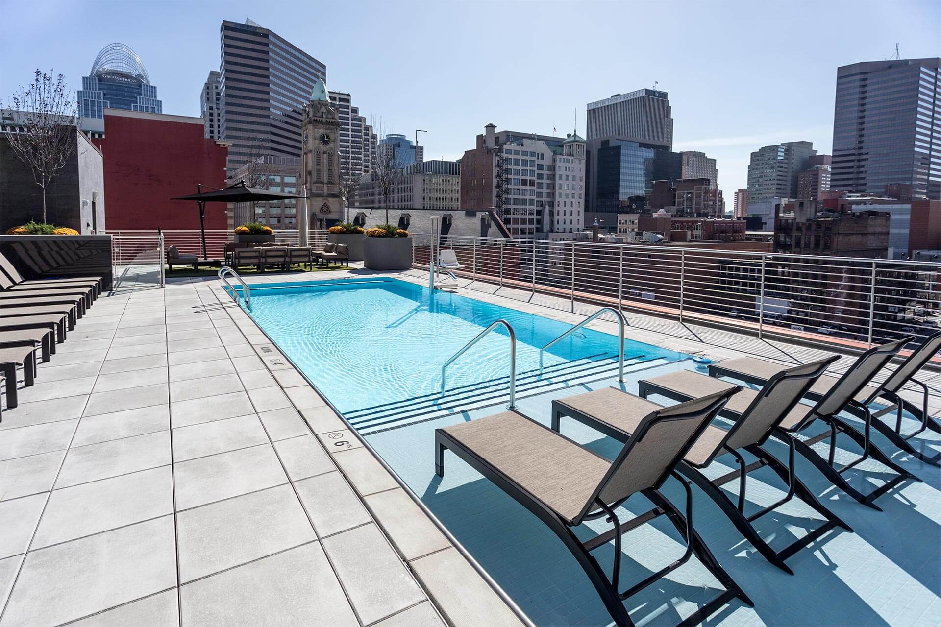 Rooftop pool glistens with rippling water