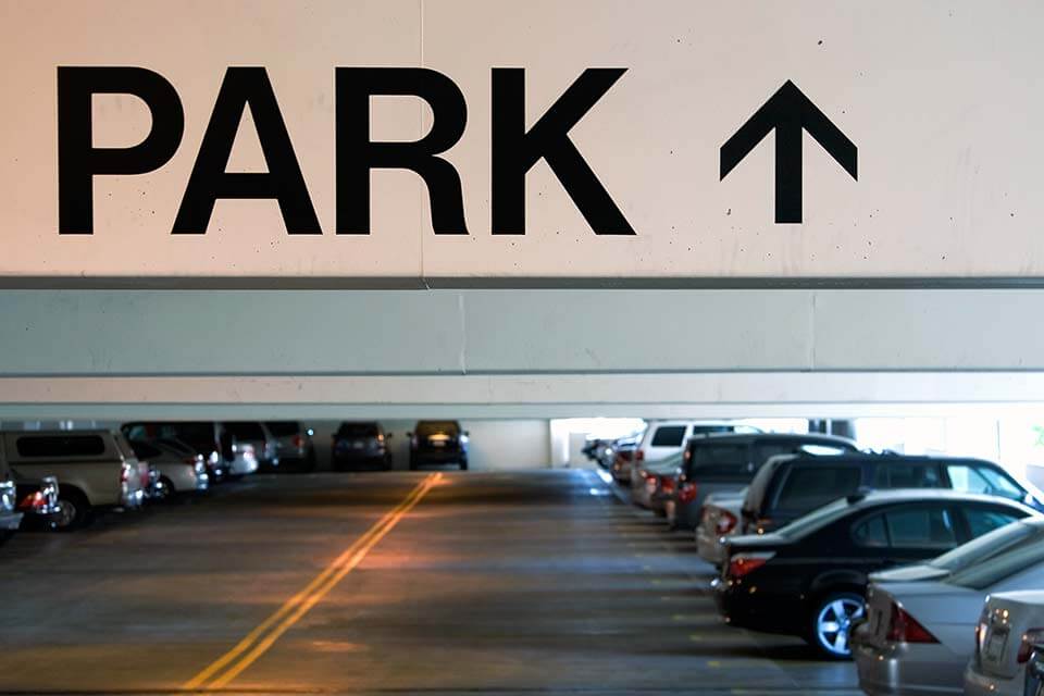 Overhead garage parking sign in parking garage