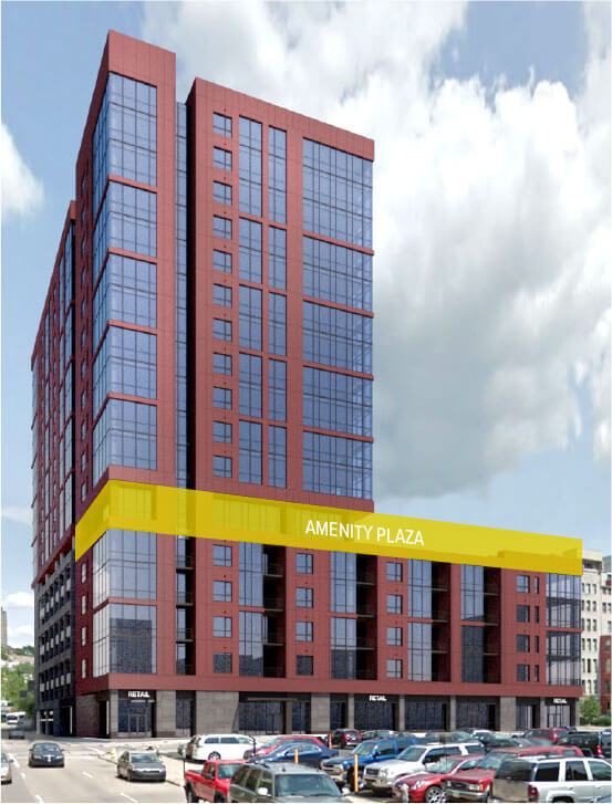A red-brick glass high-rise building